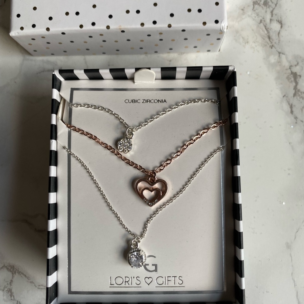 Cubic zirconia 3pc necklace set . Three individual necklaces with extensions .